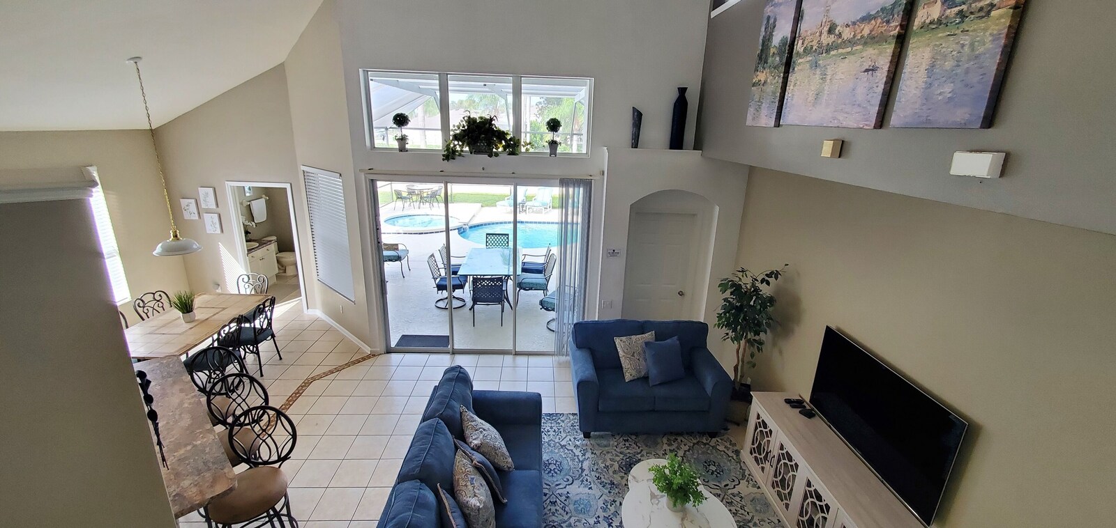 Open living room and dining area looking onto the pool